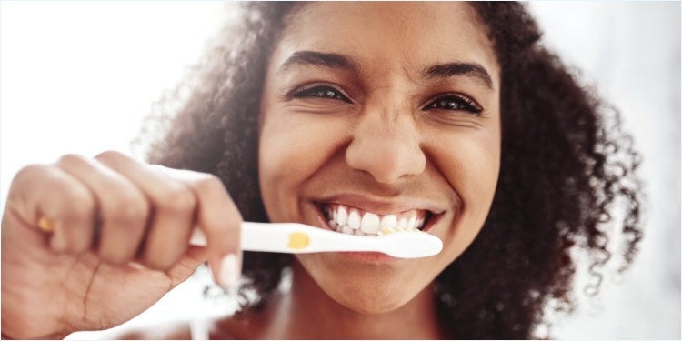 Girl brushing teeth